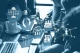 renewable energy symbols overlaid on image of people working on laptops; Carbon credits and changing energy market