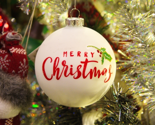 robert-linder-CApbjQPRl28-unsplash traditional Christmas ornament with the words Merry Christmas on it
