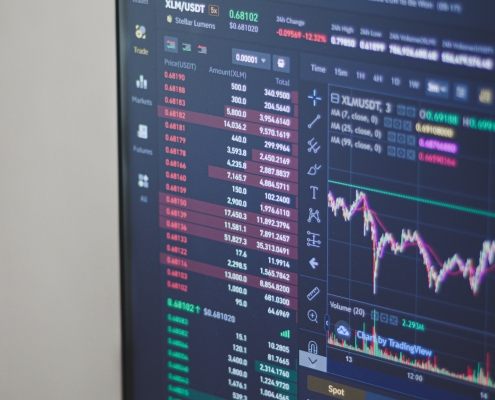 behnam-norouzi-mp11_hrQXf8-unsplash image of computer screen with trading data on it; hedging 101; year in review - 2024