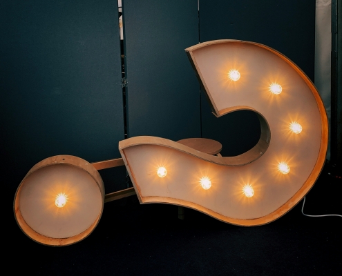 jon-tyson-hhq1Lxtuwd8-unsplash image of a question mark on its side; Carbon Credits and Changing Energy Market; market predictions for 2025