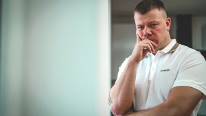 rene-ranisch-b0CuVqUxABI-unsplash man in white shirt with hand to his mouth; thinking