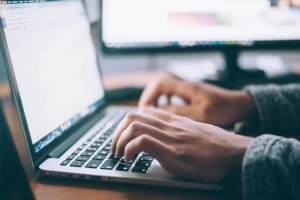 glenn-carstens-peters-npxXWgQ33ZQ-unsplash image of hands typing on an open laptop