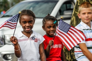 children-6665598_1280 three children in front of white car, two holding an American flag; 4th of July