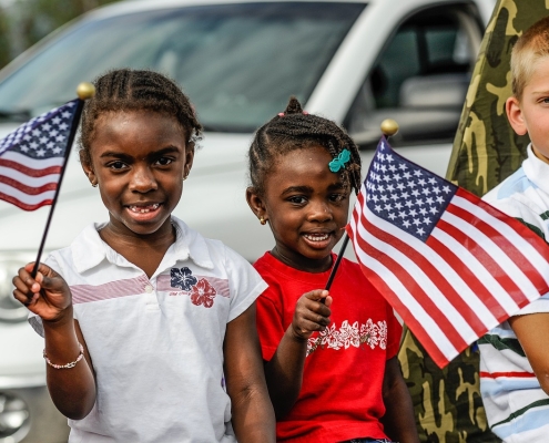 children-6665598_1280 three children in front of white car, two holding an American flag; 4th of July
