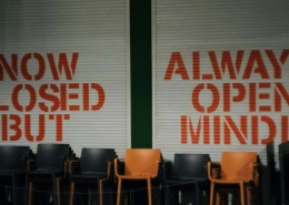aliaksei-lepik-Y9zVKTjHYkY-unsplash image of storefront with "no closed but" "always open minded" written on it; Soft Skills Matter: Flexibility