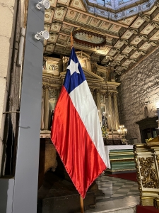 jacqueline-dias-lkGHSIAKuCs-unsplash image of Chilean flag hanging inside a baroque building; Chile - an emerging energy market