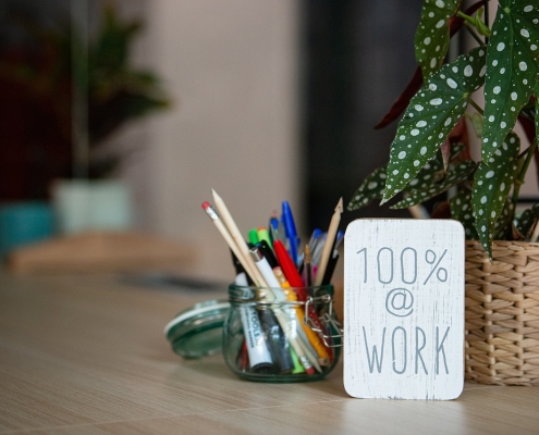desk-5484582_1280 desktop with plant and sign saying 100%; Soft Skills Matter: Work Ethic