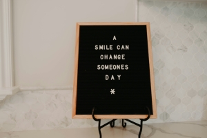 kenny-eliason-5VcSuWePr8Q-unsplash black board with white text -a smile can change someone's day; Soft Skills Matter - work ethic