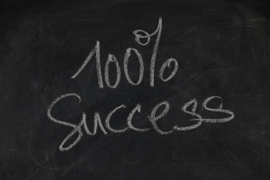 board-1193334_1280 blackboard with 100% success written in chalk on it; Beyond Expectations