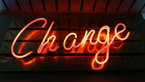 ross-findon-mG28olYFgHI-unsplash lighted word "change" - sign against a wood background; Carbon Credit and the Changing Energy Market