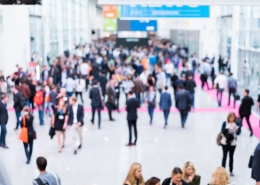 blurred anonymous people walking blurred image of crowd of people walking in a conference hall; 2025 NPGA Southeastern and International Expo