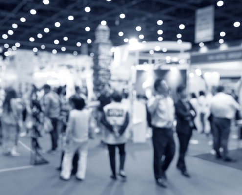Abstract blurred event exhibition with people background, business convention show concept blurry image of people at a trade show