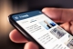 smart phone screen with showing "news" at the top with blurry images and text; current events June 2025
