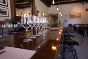 Mauriston Wine Glass picture Image of wine glasses in a line on a bar in an elegant room, soft lighting; Appreciation is the Theme - Westlark