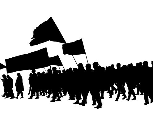Big flag on street silhouette in black of large group of people carrying flags and banners, protests; Labor day - the importance of hard work
