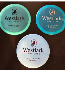 Untitled design (3) 3 discs that say Westlark Advisors; OPIS