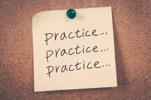practice concept note pinned to a corkboard that says "practice, practice, practice", Fierce conversations in practice