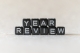 black blocks spelling "year review" on white background; year in reivew 2025
