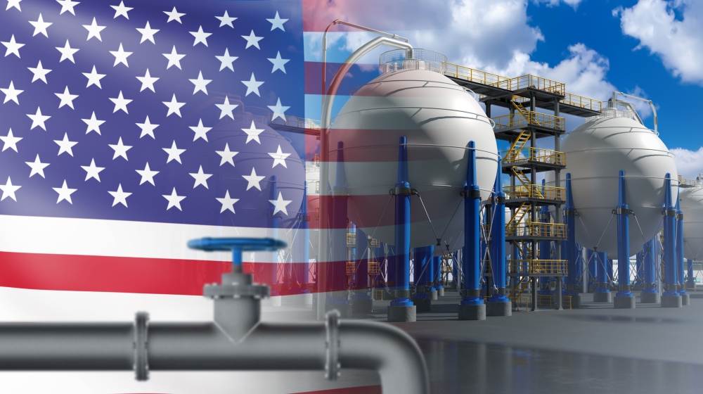 USA flag near factory. American chemical industry. Spherical tanks for oil or gas. USA chemical plant. Chemical industrial equipment. Manufactory in United States of america. USA enterprise. 3d image US flag in background with oil/LPG storage in foreground; 2026 what to expect energy; Bangladesh LPG changing routes