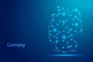 Germany map - concept of communication technology, graphic of low poly. map of Germany in lights on a dark blue background; international market highlight
