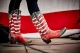 patriotic cowboy boots in front of a US flag backdrop; Nashville, Tennessee