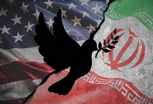 Conceptual image of war between Israel, Iran and its proxies US and Iran flag symbols pushed together with crack and silhouette of dove with olive branch in the middle; Brent oil price drop