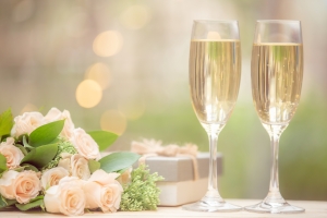 Rose flower, gift box, glass wine, on wooden table with bokeh background champagne flutes, flowers, gift against soft background, anniversary; 250th Anniversary of Independence