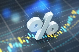 Percentage Sign on A Blue Financial Graph percentage sign resting on a financial graph; interest rates and energy market