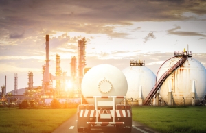 Oil and gas transportation by truck fuel truck heading toward fuel storage facility in a burst of sunlight; Q & A with Tina Schmitt