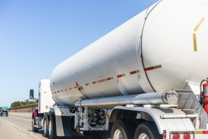 Tanker truck carrying liquefied petroleum gas driving on the freeway in East San Francisco Bay, California liquid propane tanker truck on the road; locational and timing spreads